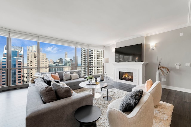 living room with hardwood / wood-style floors, floor to ceiling windows, and ornamental molding