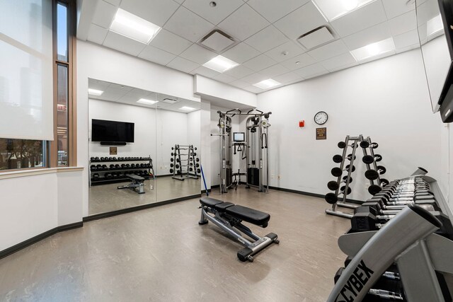 exercise room with a paneled ceiling