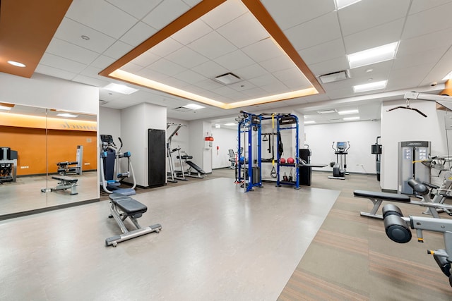 workout area featuring a drop ceiling