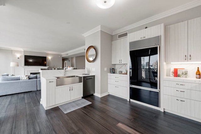 kitchen featuring dishwasher, sink, dark wood-type flooring, backsplash, and kitchen peninsula