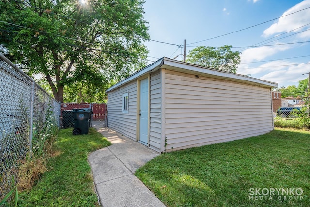 view of outdoor structure featuring a yard