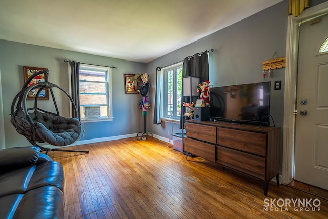 interior space with hardwood / wood-style floors and cooling unit