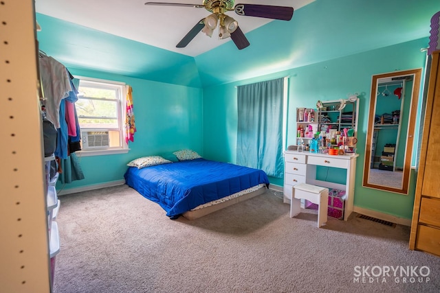 carpeted bedroom featuring vaulted ceiling, ceiling fan, and cooling unit