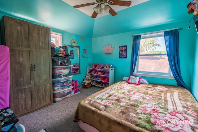 carpeted bedroom with ceiling fan and lofted ceiling