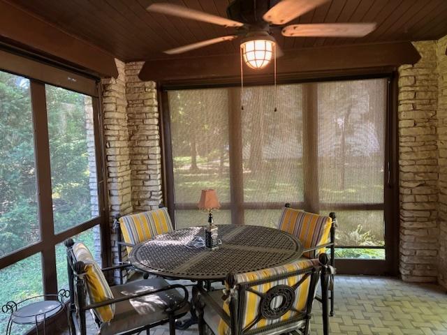 sunroom / solarium with a wealth of natural light and wood ceiling