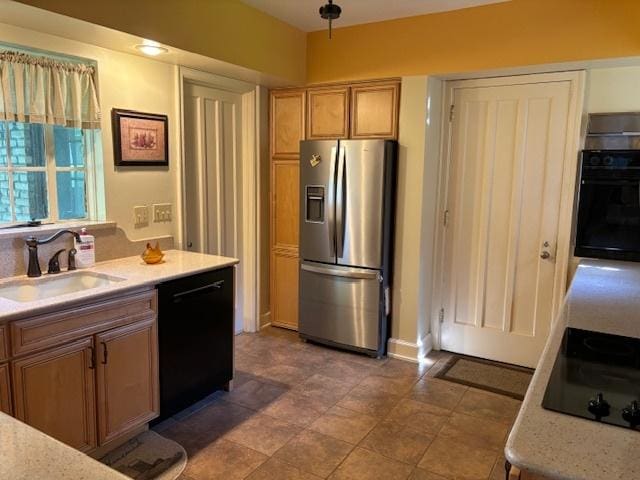 kitchen featuring sink and black appliances