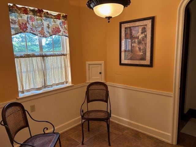 living area with dark tile patterned floors