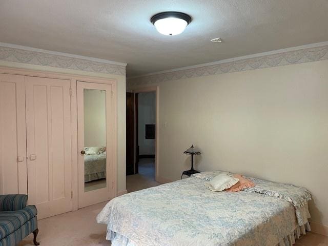 bedroom with crown molding and carpet floors