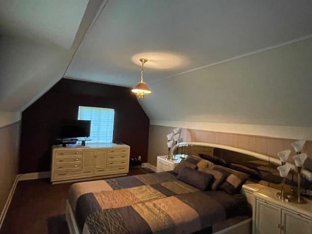 bedroom with lofted ceiling