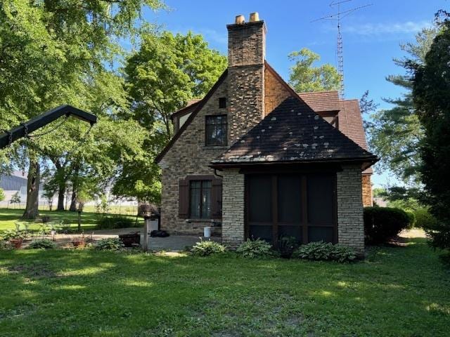 rear view of house with a yard