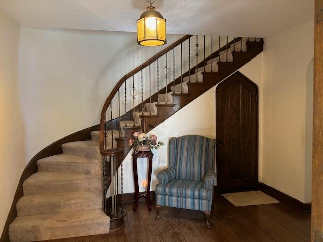 stairs with hardwood / wood-style flooring