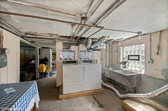 basement with sink and independent washer and dryer