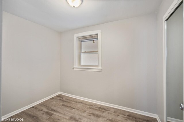 unfurnished room with light wood-type flooring