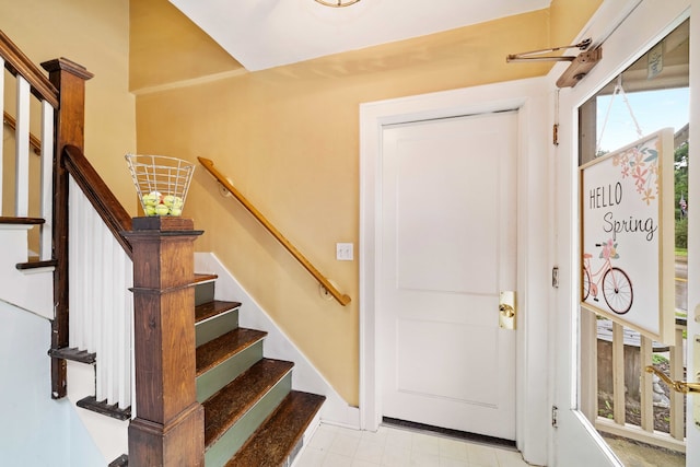 entryway featuring light tile floors