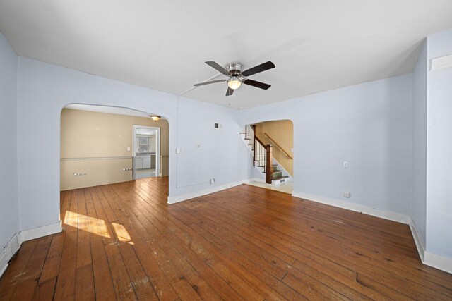 empty room with wood-type flooring and ceiling fan