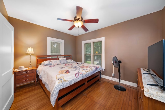 bedroom with wood-type flooring and ceiling fan