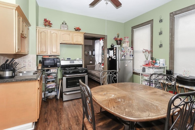 kitchen with backsplash, stainless steel appliances, sink, light brown cabinets, and dark hardwood / wood-style floors