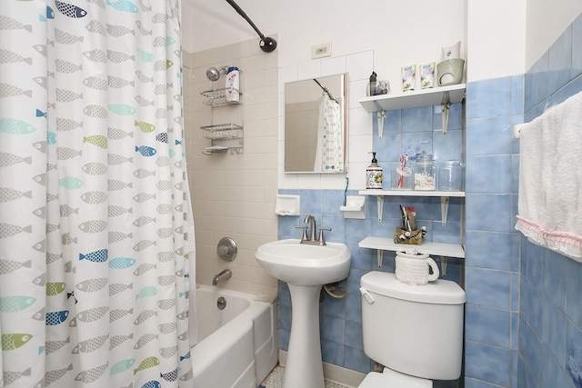 bathroom featuring tasteful backsplash, toilet, tile walls, and shower / bath combo with shower curtain