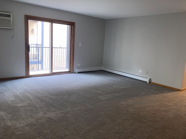 empty room featuring a wall mounted AC, carpet flooring, and baseboard heating