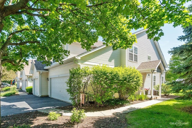 415 Canterbury Ct, Oswego, IL 60543 - view of front facade featuring asphalt driveway and an attached garage