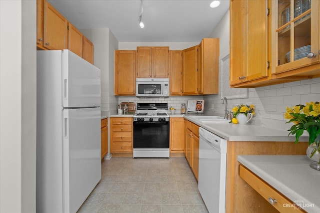 415 Canterbury Ct, Oswego, IL 60543 - kitchen with white appliances, light countertops, tasteful backsplash, glass insert cabinets, and light tile patterned floors