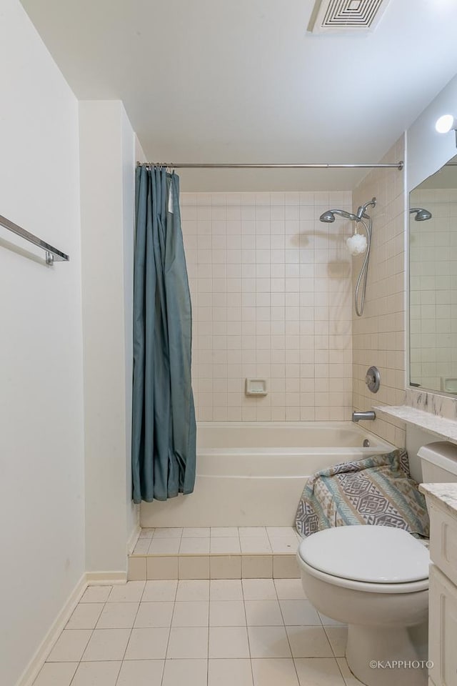 full bathroom featuring tile patterned flooring, vanity, toilet, and shower / bath combo