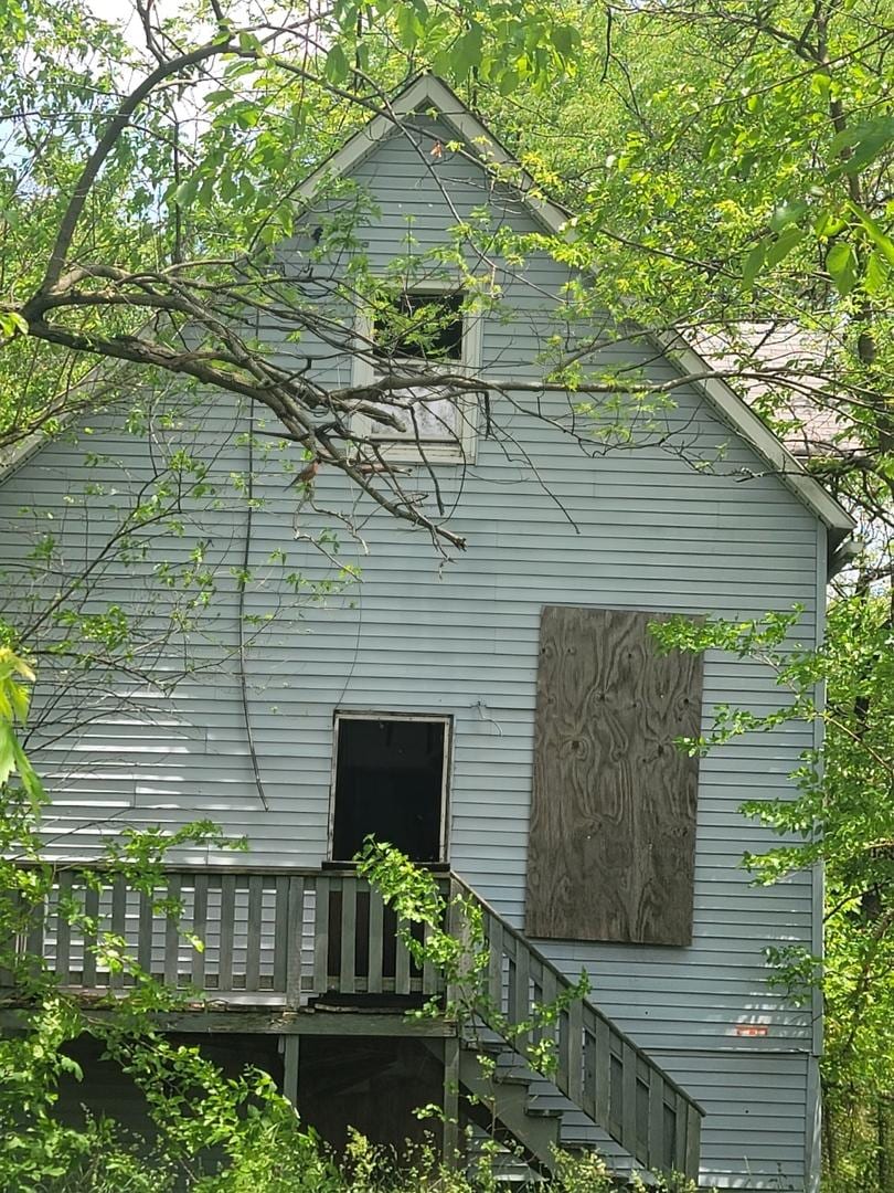 view of side of property with a deck