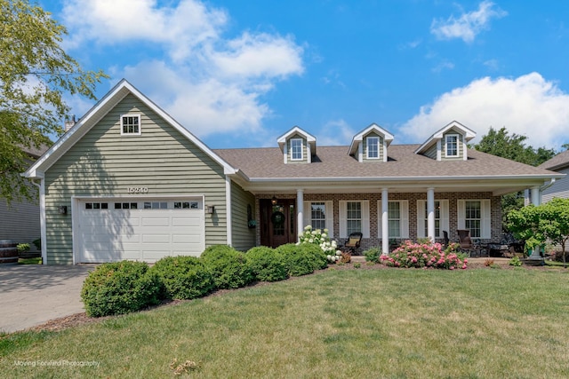 cape cod home with a garage, a front yard, and a porch