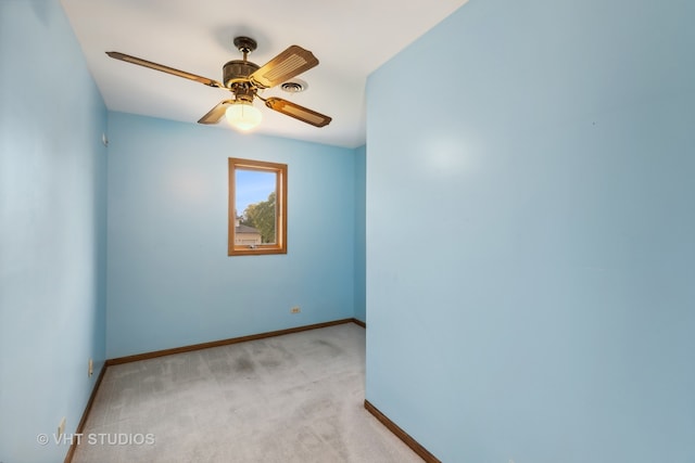 unfurnished room with ceiling fan and light colored carpet