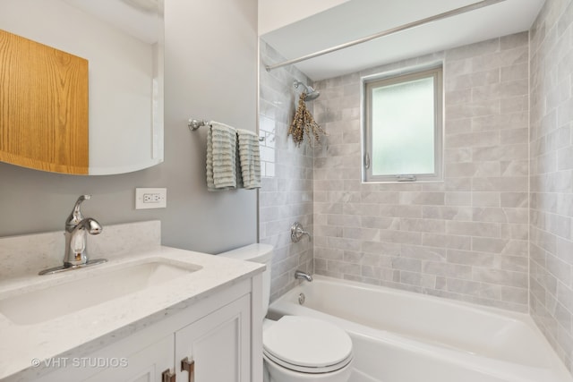 full bathroom with vanity, toilet, and tiled shower / bath