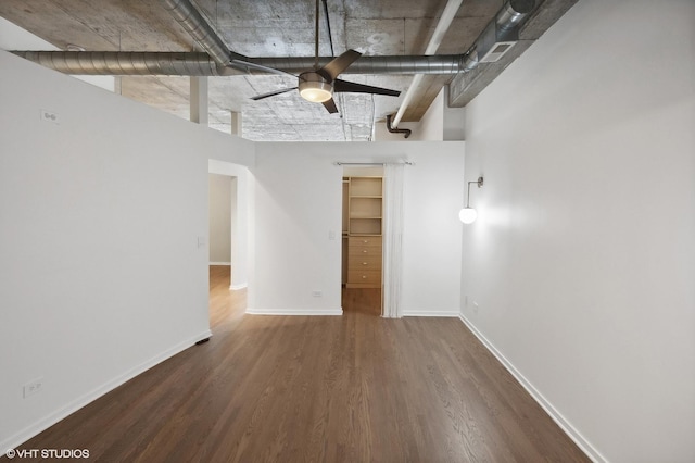 basement with hardwood / wood-style flooring and ceiling fan