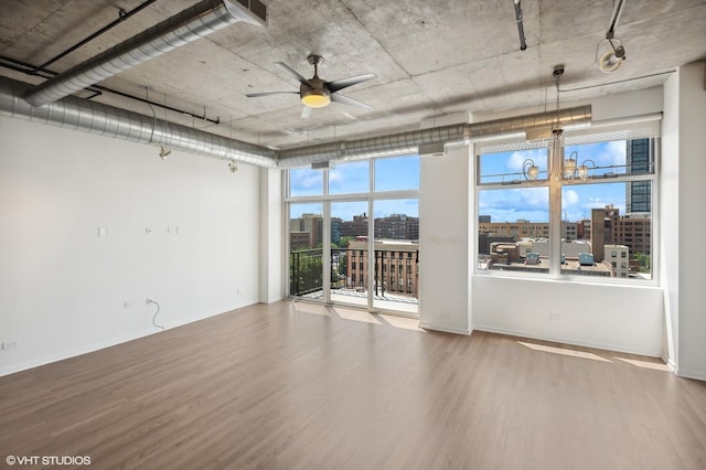 unfurnished room featuring wood-type flooring and ceiling fan