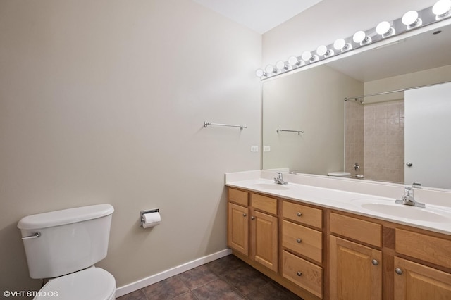 bathroom featuring tile patterned floors, vanity, and toilet