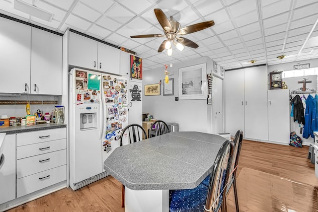 dining space featuring light hardwood / wood-style floors and ceiling fan