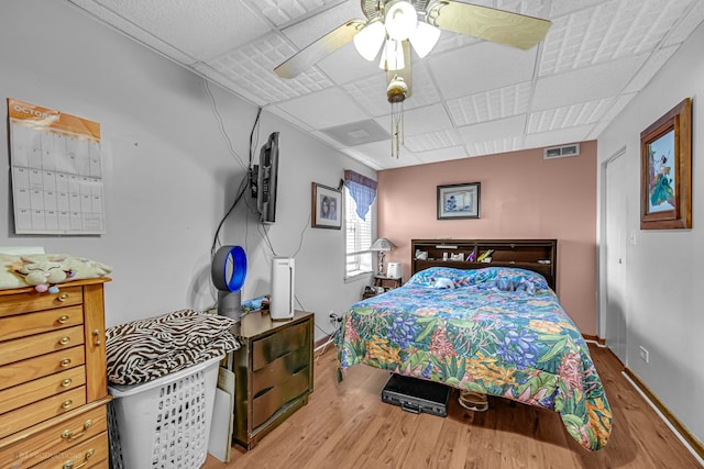 bedroom featuring wood-type flooring and ceiling fan