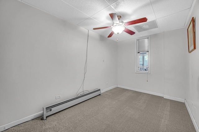 3600 S Union Ave, Chicago, IL 60609 - unfurnished room featuring a baseboard heating unit, a ceiling fan, carpet flooring, and a paneled ceiling