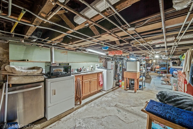 basement with sink and washer and dryer