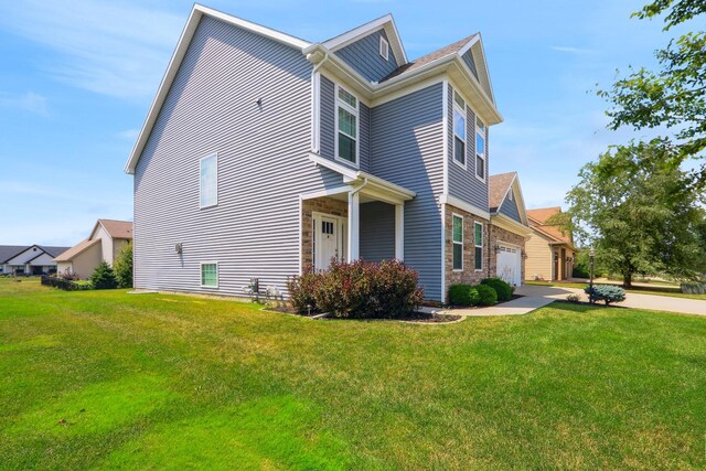 view of front facade with a garage and a front lawn