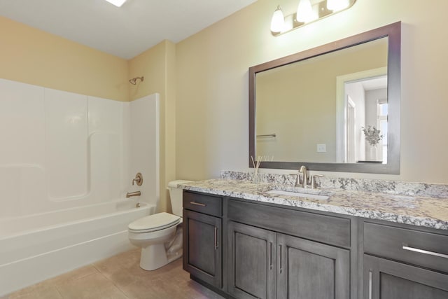 full bathroom with tile patterned floors, toilet, vanity, and shower / bath combination