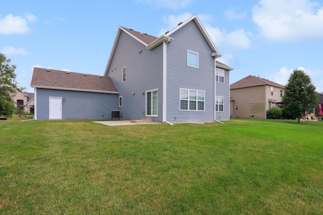 back of house with a yard, central AC, and a patio