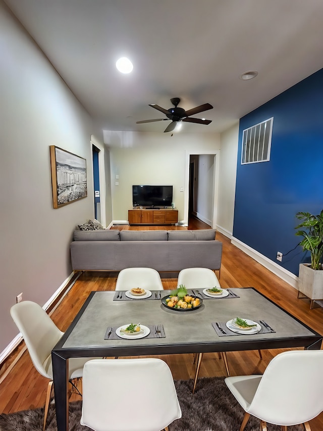 dining room featuring hardwood / wood-style floors and ceiling fan