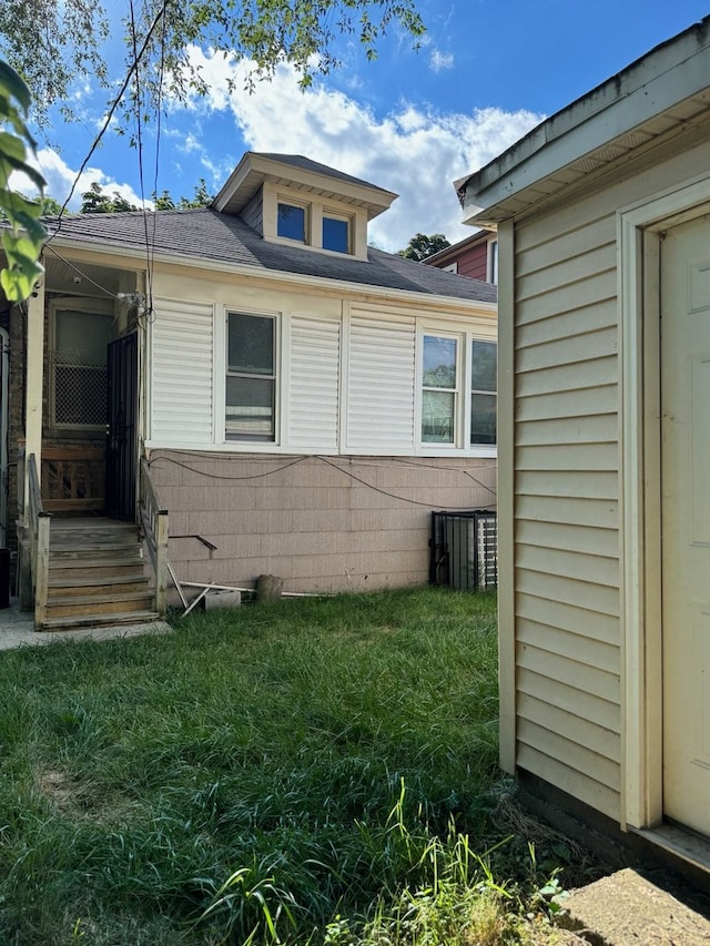 view of home's exterior featuring a yard