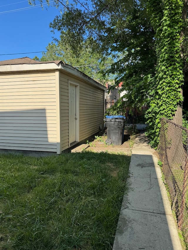 view of outdoor structure with a lawn