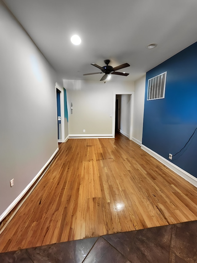 spare room with ceiling fan and light hardwood / wood-style floors