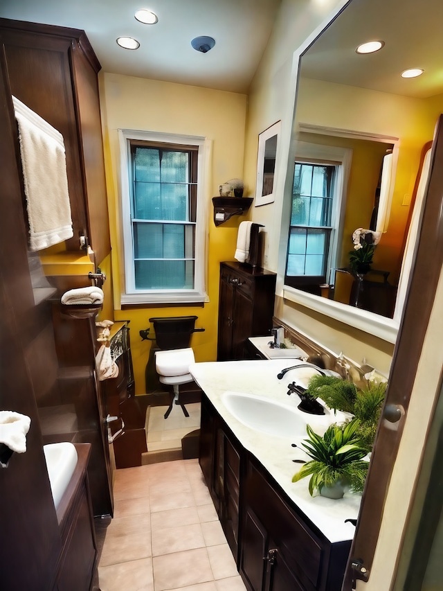 bathroom with tile patterned flooring and vanity