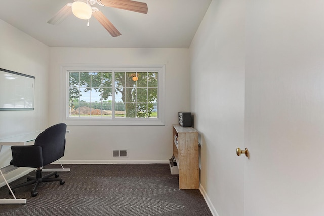 carpeted office with ceiling fan