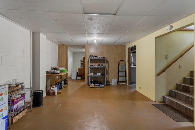 basement with a paneled ceiling