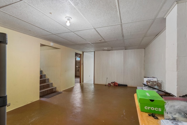 basement featuring a drop ceiling