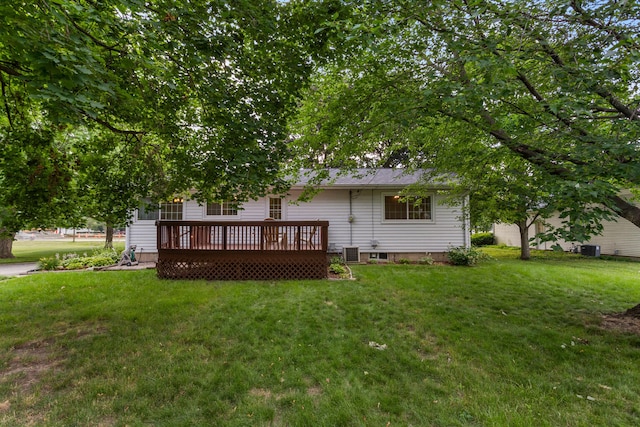 back of property featuring a yard, a deck, and central air condition unit