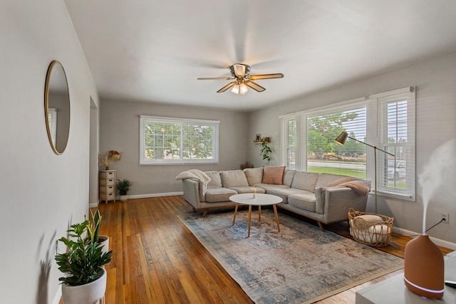 living room with ceiling fan, a healthy amount of sunlight, and wood-type flooring